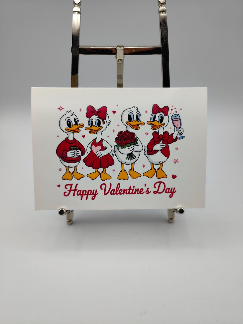 May include: A Valentine's Day greeting card featuring four cartoon ducks. Each duck is dressed in red and white attire, holding a coffee cup, wearing a heart-shaped dress, holding roses, and holding a glass of wine. The words "Happy Valentine's Day" are written in red.