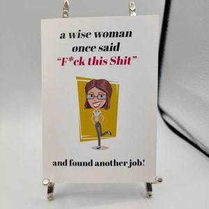 May include: A white card with black text that reads "a wise woman once said "F*ck this Shit" and found another job!"  A cartoon illustration of a woman with brown hair, glasses, and a yellow shirt is on the card.