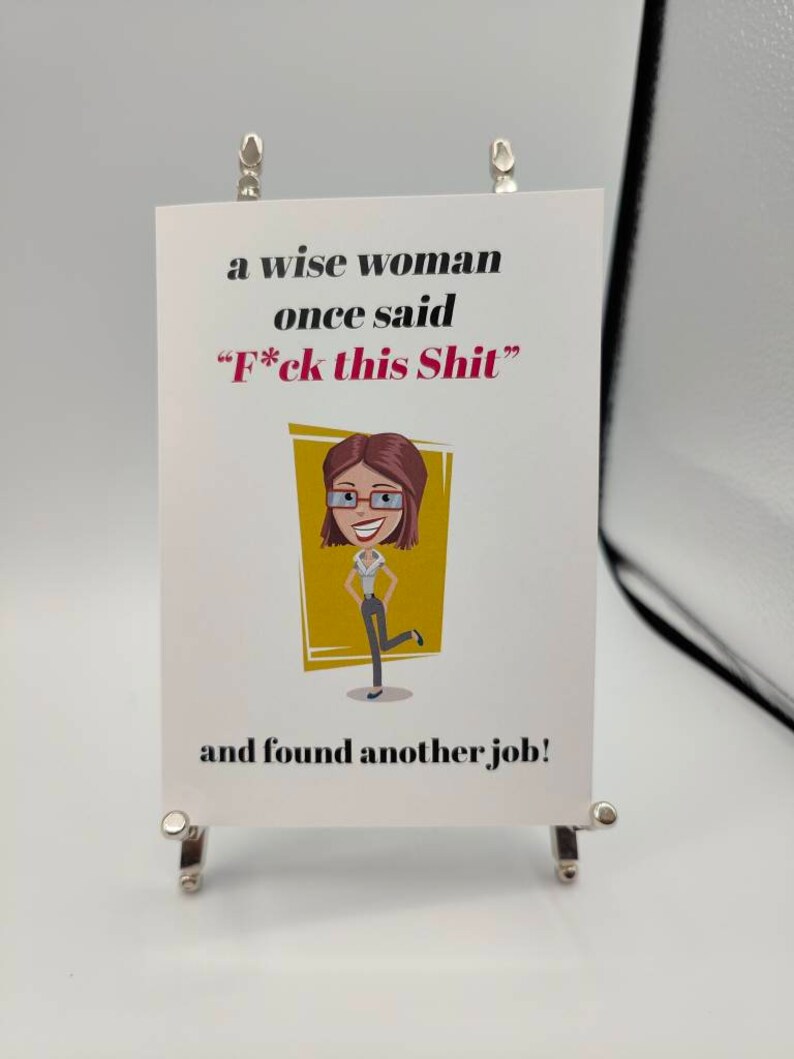May include: A white card with black text that reads "a wise woman once said "F*ck this Shit" and found another job!"  A cartoon illustration of a woman with brown hair, glasses, and a yellow shirt is on the card.
