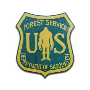 Servicio Forestal de EE. UU. - Departamento de Sasquatch Letrero de metal para carretera Letrero de Bigfoot Letrero de Sasquatch - Regalo para entusiastas de Bigfoot, decoración de cabañas