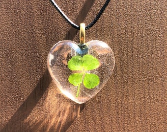 Real 4 Leaf Clover Pendant encased in Heart Shape Resin with black waxed necklace cord