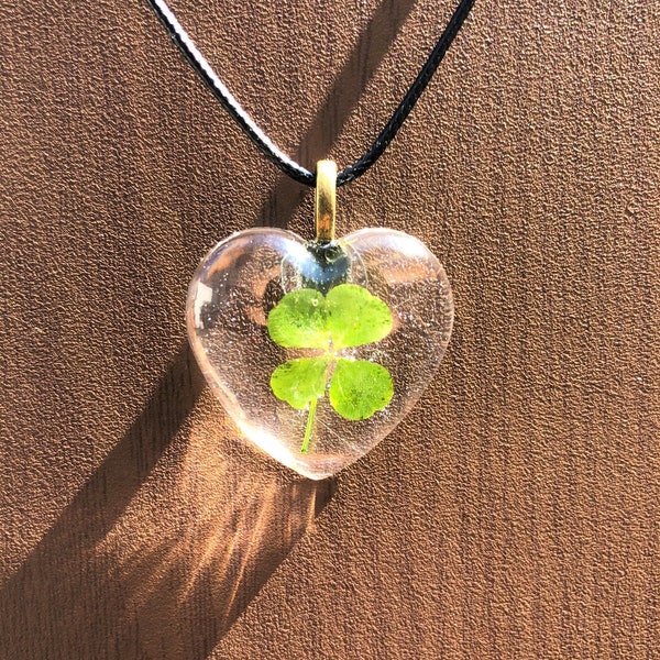 Real 4 Leaf Clover Pendant encased in Heart Shape Resin with black waxed necklace cord