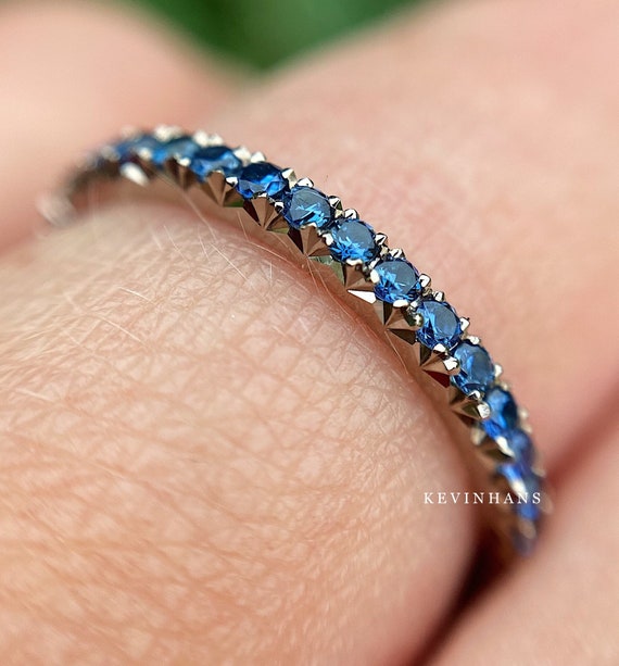 Blue sapphire eternity band yellow gold online
