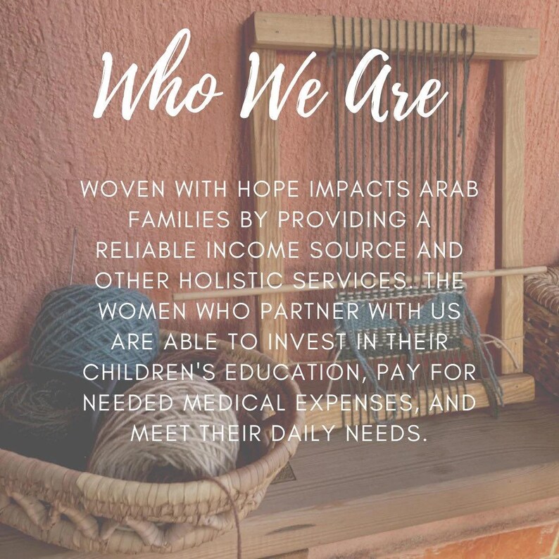 May include: A close-up of a woven basket filled with colorful yarn balls. The text "Who We Are" is written in white on a pink background. The text below reads "Woven with Hope impacts Arab families by providing a reliable income source and other holistic services. The women who partner with us are able to invest in their children's education, pay for needed medical expenses, and meet their daily needs."