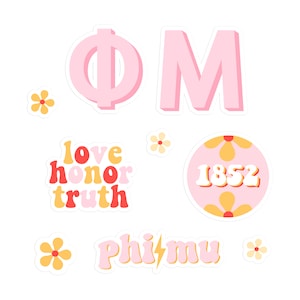 May include: A set of pink and yellow stickers with the letters Phi Mu, the year 1852, and the words "love, honor, truth".