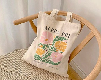 fourre-tout ALPHA PHI à motif floral bohème rose | Cabas APHI, produit commercial Sorority, sac de marché, offre d'achat 2024, cadeau