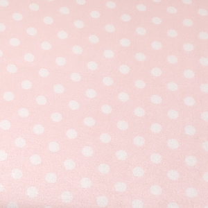 May include: A pink fabric with a white polka dot pattern.