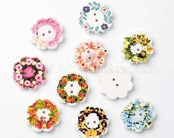 May include: Assortment of ten wooden buttons with two holes each. The buttons are decorated with floral wreaths in various colors, including pink, yellow, blue, and green.