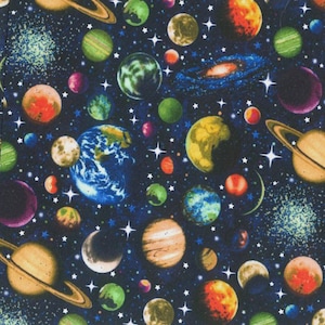 May include: A fabric pattern showing a colourful depiction of space. Planets in shades of blue, green, orange, and purple are scattered across a dark blue background. White stars and galaxies complete the space-themed design.