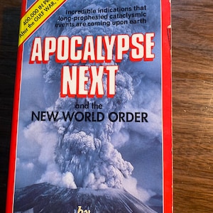 May include: A red book with the title "Apocalypse Next and the New World Order" by William R. Goetz. The cover features a photo of a volcano erupting with a large plume of smoke.