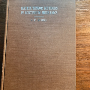 May include: A brown book with the title "Matrix-Tensor Methods in Continuum Mechanics" and the author's name "S.F. Borg" printed in white on the cover.