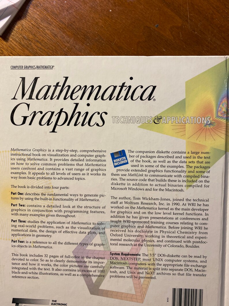 May include: A book cover with the title "Mathematica Graphics: Techniques & Applications". The cover features a colorful, abstract graphic design with a yellow, orange, and red color scheme. The book is a step-by-step guide to using Mathematica for visualization and computer graphics.