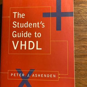 以下が含まれることがあります： 表紙に「The Student's Guide to VHDL」というタイトルと著者名「Peter J. Ashenden」が印刷された赤い本。表紙には青いプラス記号と青いXが描かれている。