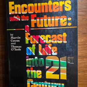 May include: A book cover with a black background and colourful text. The title is "Encounters with the Future: A Forecast of Life into the 21st Century". The author is Marvin Cetron and Thomas O'Toole.