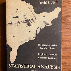 May include: A black and white book cover with the title "Statistical Analysis for Areal Distributions" by David S. Neft. The cover features a map of the United States.