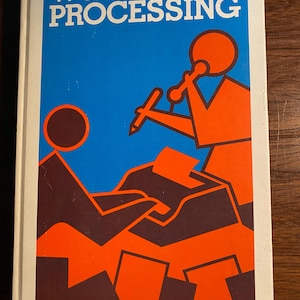May include: A book cover with a blue background and the title "WORD PROCESSING" in white letters. The cover features a red stick figure holding a pencil and a red typewriter.