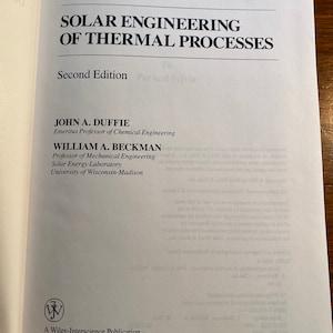 May include: The cover of a book titled "Solar Engineering of Thermal Processes" by John A. Duffie and William A. Beckman. The book is a Wiley-Interscience Publication and is in its second edition.