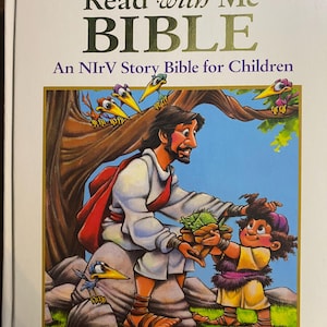 May include: A children's Bible titled "Read with Me BIBLE" with the text "An NIrV Story Bible for Children." The cover illustration depicts a man and a child with birds in a tree. The book is published by Zonderkidz.