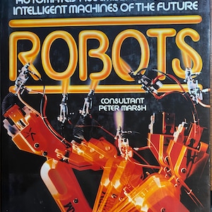 May include: A book cover with the title "ROBOTS" in large, glowing orange letters. The cover features a detailed illustration of robotic arms in shades of orange and red against a dark background. Text at the top reads "A Superbly Illustrated Analysis of the Robotics Age."