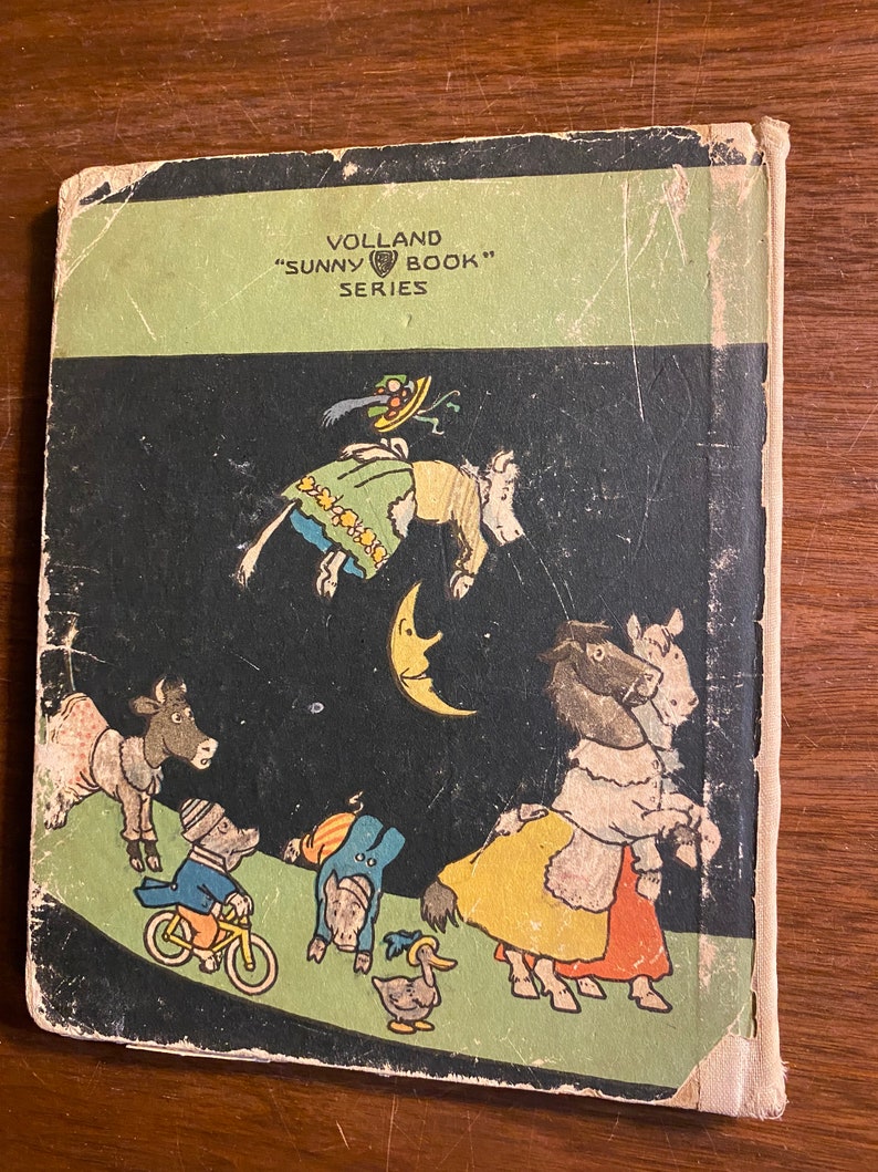 K&ouml;nnte beinhalten: Ein Vintage-Kinderbuchcover mit schwarzem Hintergrund und bunten Illustrationen von Tieren. Der Buchtitel lautet "Sunny Book" und der Verlag ist "Volland Series".
