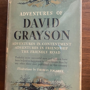 May include: A vintage book titled "Adventures of David Grayson" with a green cover. The title is in large, bold black letters. The cover also features illustrations and text about contentment, friendship, and the friendly road.