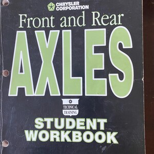 May include: A black and green student workbook for Chrysler Corporation's Technical Training programme. The cover features the text "Front and Rear Axles" in large green letters.
