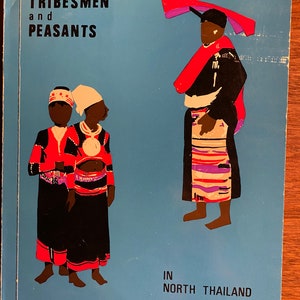 May include: A book cover with the title "TRIBESMEN and PEASANTS IN NORTH THAILAND". The cover features illustrations of three people in traditional clothing. The people are standing on a blue background.