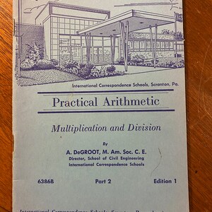 May include: A blue and white booklet titled "Practical Arithmetic: Multiplication and Division" by A. DeGroot, M. Am. Soc. C. E., Director, School of Civil Engineering, International Correspondence Schools. The booklet is part 2, edition 1, and features a black and white illustration of a building with a large awning.