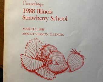 Puede incluir: Una portada roja y blanca para un libro titulado "Proceedings 1988 Illinois Strawberry School" con la fecha "March 2, 1988" y la ubicación "Mount Vernon, Illinois". La portada también incluye un dibujo de fresas y hojas.