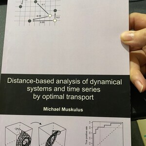 May include: A book cover with the title "Distance-based analysis of dynamical systems and time series by optimal transport" by Michael Muskulus. The cover features a black and white diagram of a grid with points and lines, and a black and white diagram of a 3D cube with a swirling pattern inside.