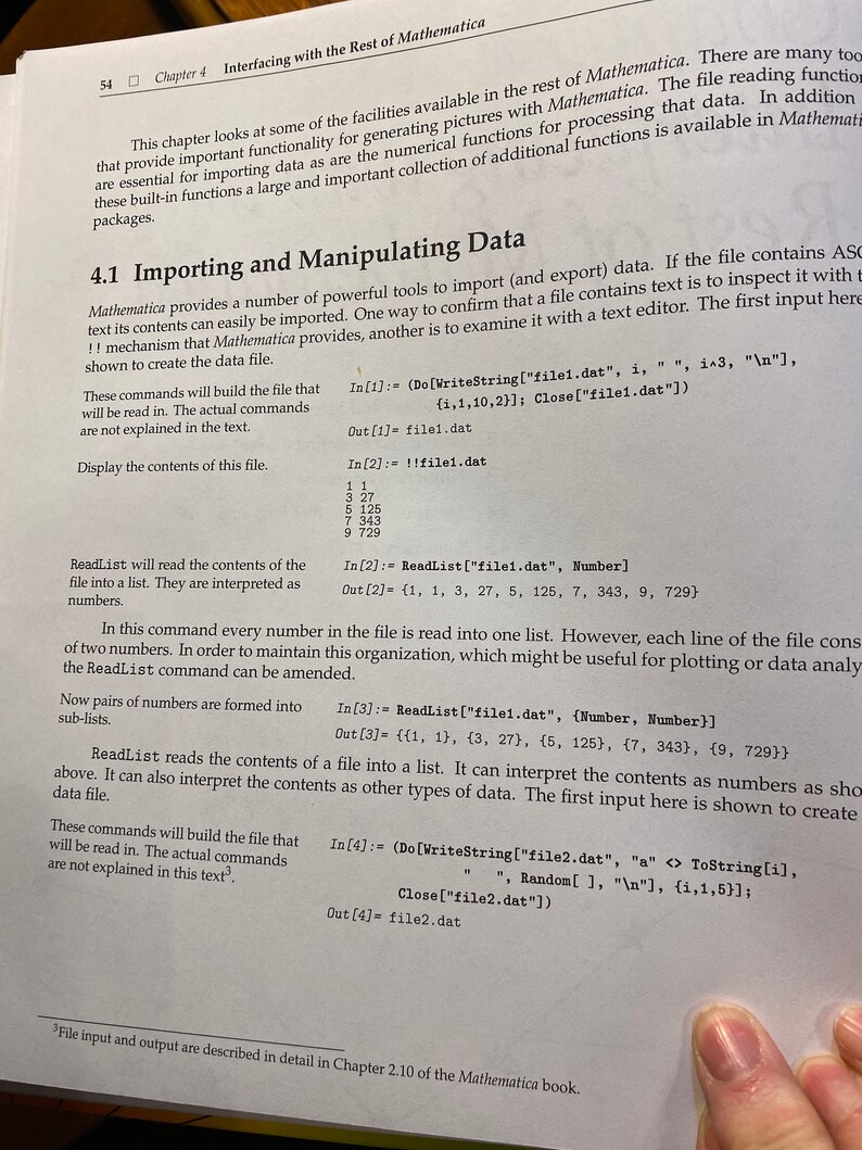 May include: A page from a textbook about importing and manipulating data in Mathematica. The page shows code examples for reading data from a file and creating a list of numbers.