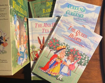 May include: A set of four children's books about Alice in Wonderland. The books are titled "Alice in Wonderland", "Down the Rabbit Hole", "The Mad Hatter's Tea Party", and "Curiouser and Curiouser: The Queen of Hearts".