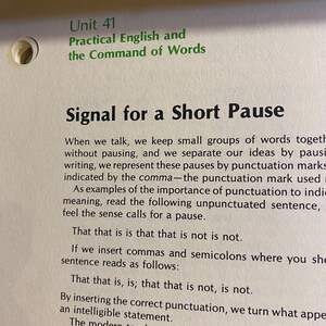May include: Open book page with the title "Signal for a Short Pause" and the text "Practical English and the Command of Words." The text discusses the use of commas and punctuation in writing.