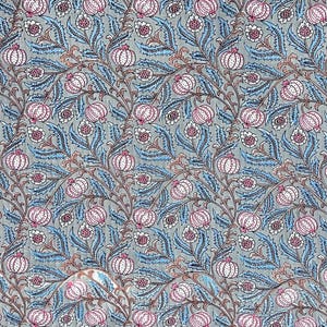 May include: A fabric textile featuring a repeating botanical pattern on a light gray background. The design consists of stylized pink and white pomegranate-like fruits and intricate blue serrated leaves connected by thin, dark brown winding vines.