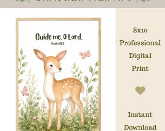 May include: A framed wall art print featuring a watercolour illustration of a fawn standing in green foliage with two small pink butterflies. The text reads Guide me, O Lord. Psalm 25:5. The print is labelled as an 8x10 professional digital print.