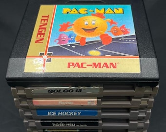 7 NES Game Lot Nintendo Cartridges Misc Classics Dust Sleeves Included: Barbie, Pac-Man-, Ice Hockey, Tiger-Heli, T&C Surd Designs, Etc