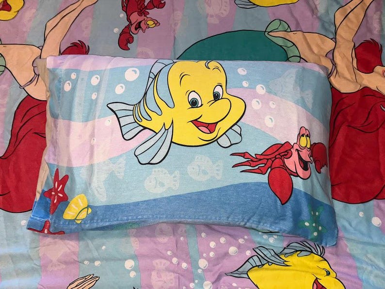 May include: A set of three ceramic mugs with a speckled, matte finish. The mugs are in shades of cream, light gray, and dark gray. Each mug has a simple, minimalist design and a rounded handle.