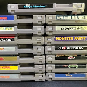 NES Nintendo Game Cartridges LOT 15 Classics w/ Dust Sleeves Kirby, TMNT, Ghostbusters, Silver Surfer, Metal Gear, Super Mario Bros & more image 2