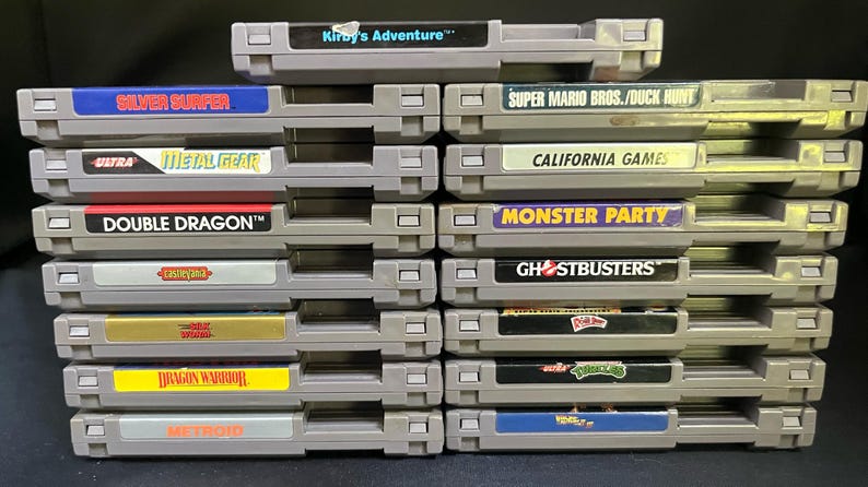 NES Nintendo Game Cartridges LOT 15 Classics w/ Dust Sleeves Kirby, TMNT, Ghostbusters, Silver Surfer, Metal Gear, Super Mario Bros & more image 2