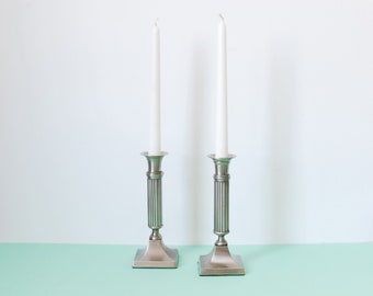 Pair of silver metal candlesticks