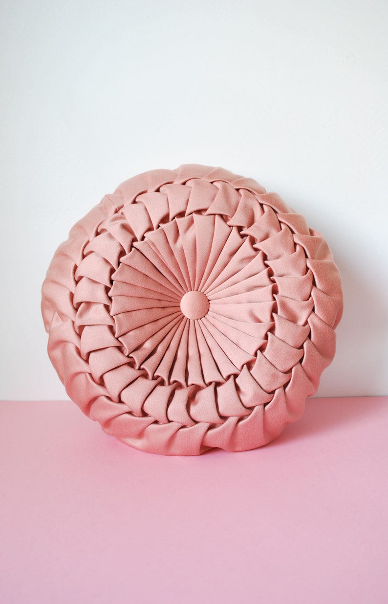 Beautiful pink round decorative cushion draped with two sides vintage