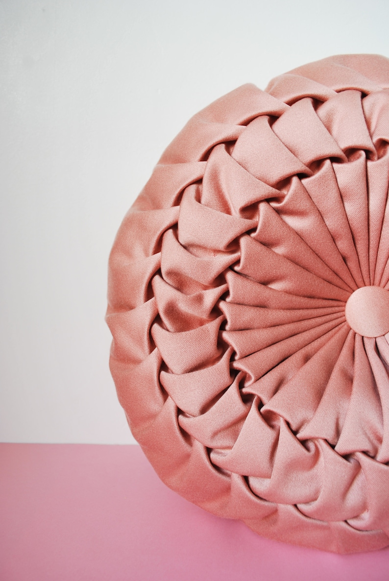 Beautiful pink round decorative cushion draped with two sides vintage