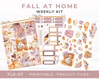 May include: A weekly kit with a fall theme, featuring watercolor illustrations of pumpkins, houses, tea cups, and floral arrangements. The kit includes decorative stickers and planner elements. The text "FALL AT HOME WEEKLY KIT" is displayed at the top.