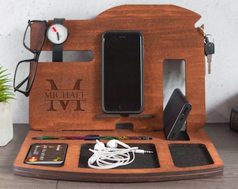 May include: A wooden organiser with compartments for a phone, watch, keys, and other small items. The organiser is personalised with the name "Michael" and the initial "M".