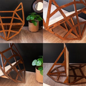 May include: A wooden geometric fox head shelf unit with three shelves. The shelf is made of brown wood and has a geometric design. The shelf is shown in different positions, including standing upright and leaning against a wall.