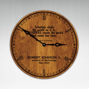 May include: A wooden clock with Roman numerals and a quote about engineers. The clock is personalised with the name "Robert Johnson, IL" and the text "Institute of Technology, May, 2023".