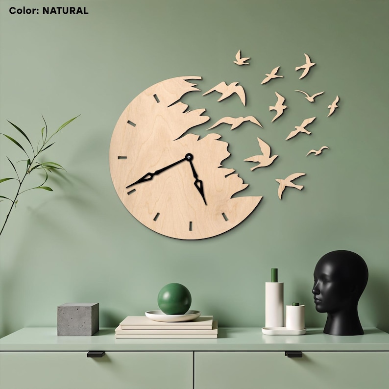 May include: A natural-colored wooden wall clock with a unique design. The clock face is a circle with a section cut out, and a flock of wooden birds appears to be flying away from it. The clock hands are black.