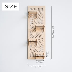 May include: A wooden wall shelf with a geometric pattern and four shelves. The shelf is 35.2 inches tall and 11.6 inches wide.