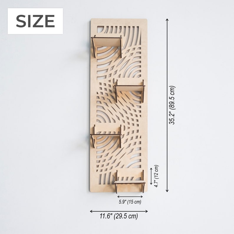 May include: A wooden wall shelf with a geometric pattern and four shelves. The shelf is 35.2 inches tall and 11.6 inches wide.