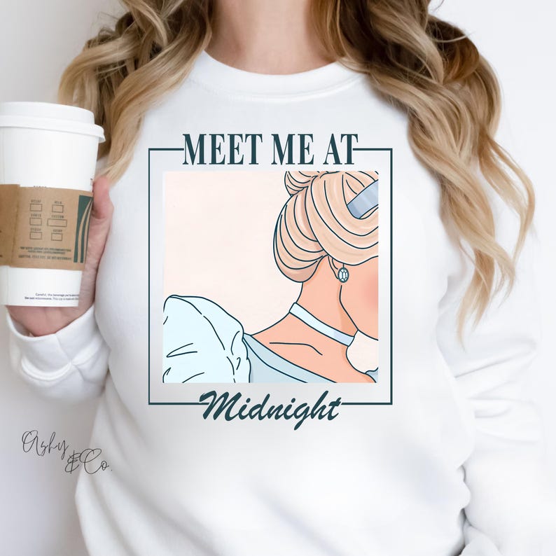 May include: White sweatshirt with a graphic of a cartoon princess with the text "Meet Me At Midnight".